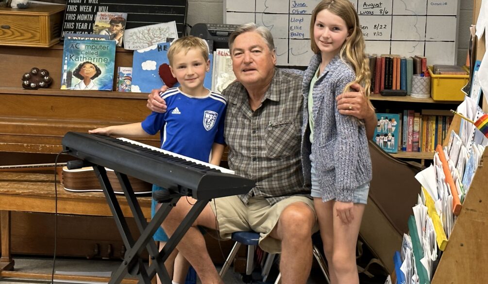 Gabriel and Grace with Grandpa at school concert
